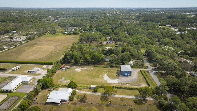 drone / aerial view featuring a forest view