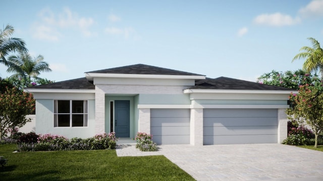 view of front of home featuring an attached garage, decorative driveway, and a front yard