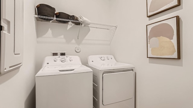 clothes washing area featuring laundry area and independent washer and dryer