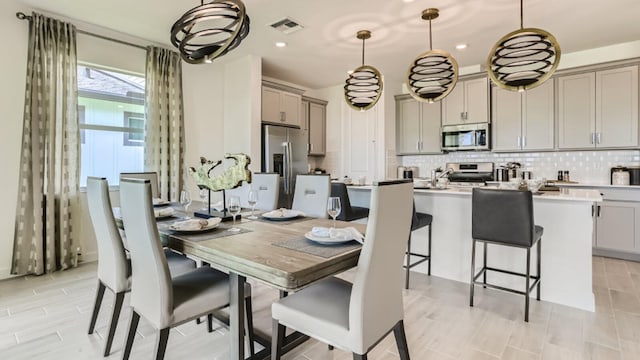 dining room featuring visible vents and recessed lighting