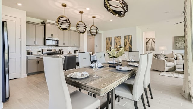 dining space with recessed lighting