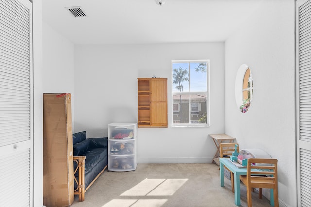 interior space with visible vents, carpet floors, and baseboards