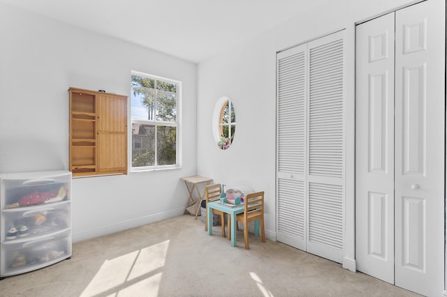 game room featuring carpet flooring and baseboards