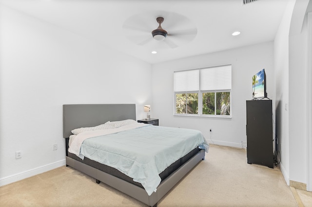 bedroom with a ceiling fan, recessed lighting, baseboards, and light carpet