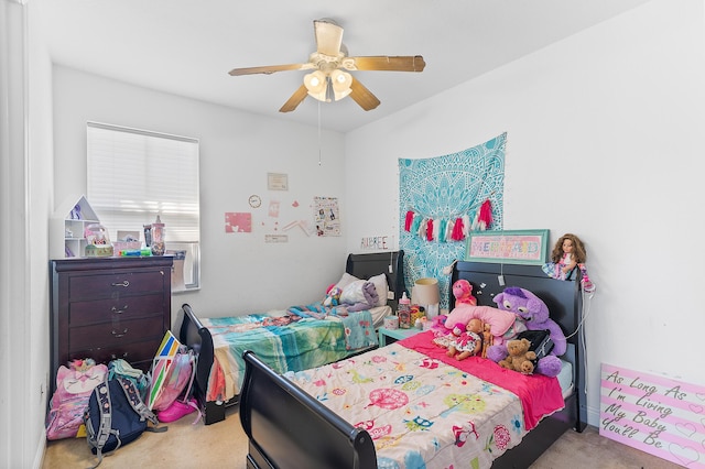 bedroom with a ceiling fan and carpet floors