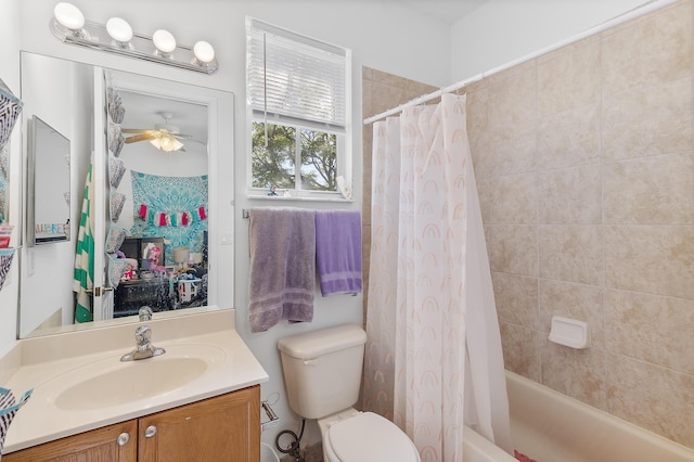 bathroom with toilet, vanity, a ceiling fan, and shower / bath combo