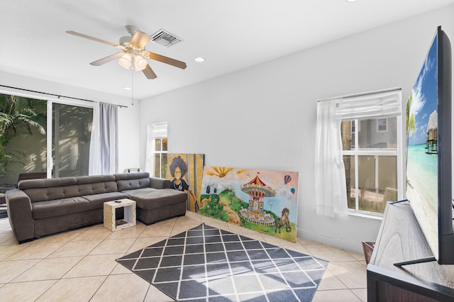 living area featuring tile patterned floors, visible vents, ceiling fan, and recessed lighting