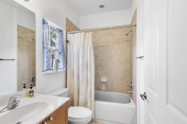 bathroom with toilet, vanity, and shower / bath combination with curtain