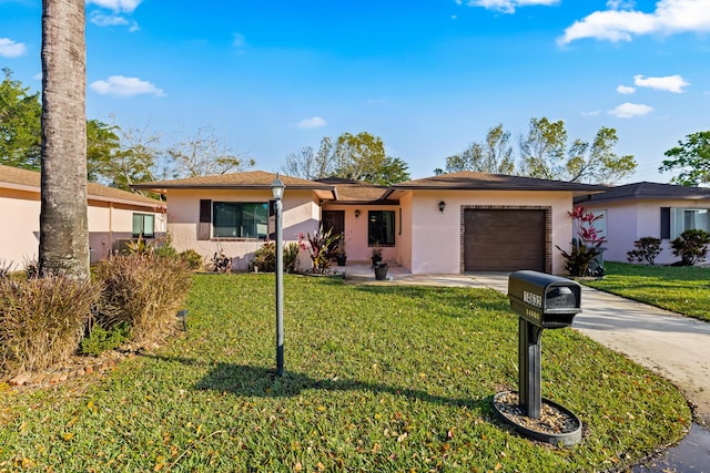 single story home featuring stucco siding, a front lawn, concrete driveway, and a garage