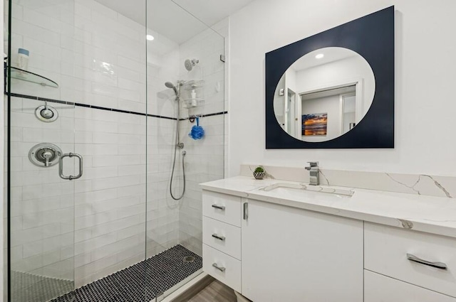 full bath featuring a shower stall and vanity