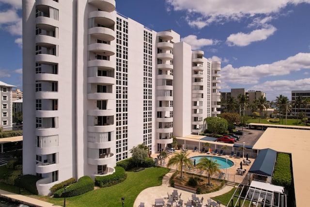 view of building exterior with a community pool