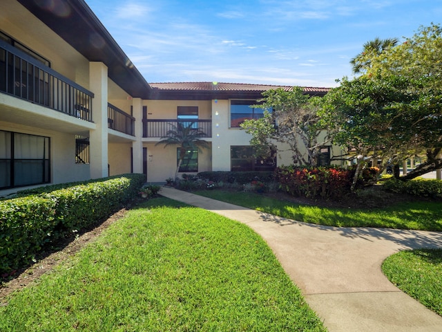 surrounding community featuring a lawn