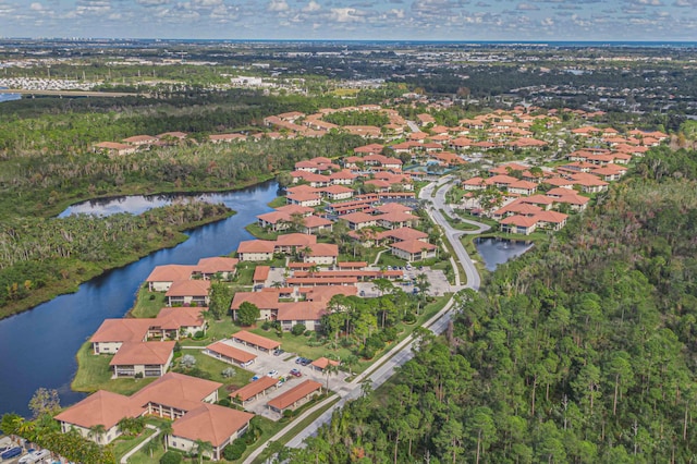 birds eye view of property with a residential view and a water view