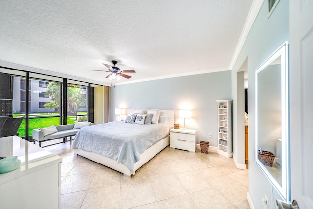 bedroom featuring light tile patterned flooring, a textured ceiling, and ornamental molding