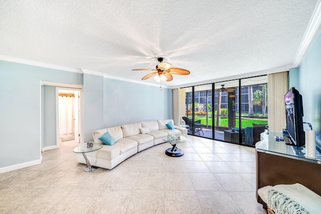 living area with baseboards, floor to ceiling windows, ceiling fan, and crown molding