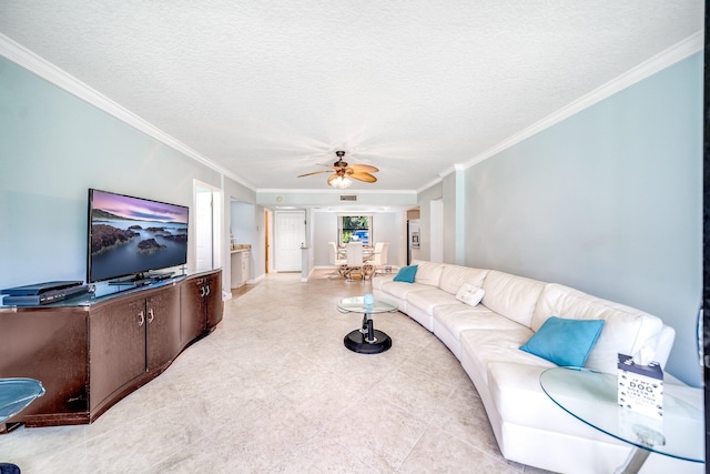 living room featuring a ceiling fan, a textured ceiling, visible vents, and crown molding