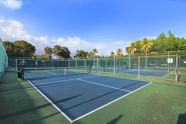 view of sport court with fence