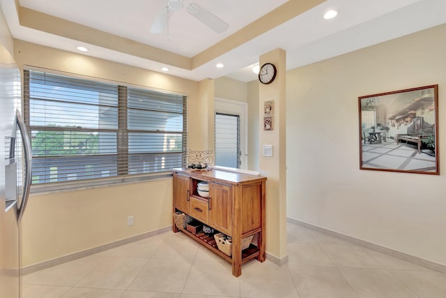 interior space featuring light tile patterned floors, baseboards, and recessed lighting