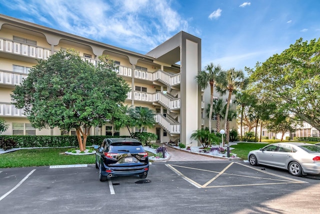 view of property with uncovered parking