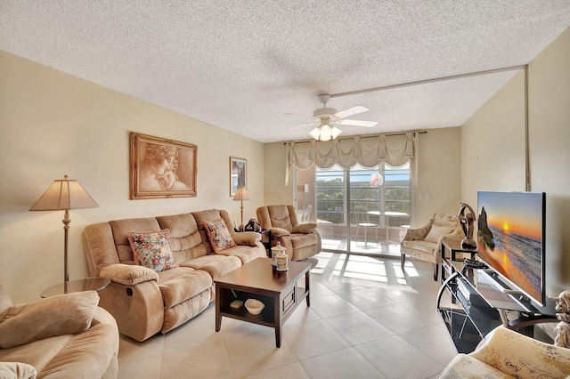 living area featuring light tile patterned floors, a textured ceiling, and a ceiling fan