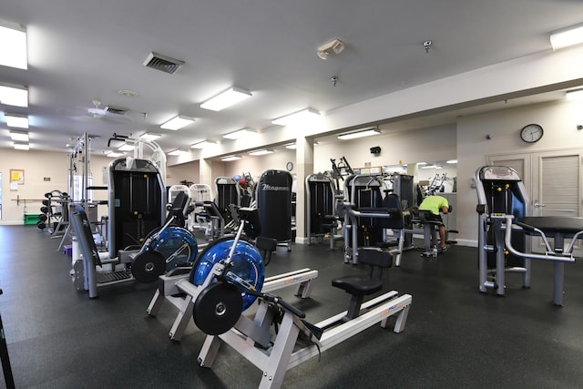 gym featuring visible vents and baseboards