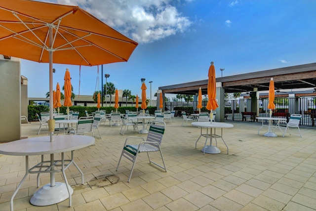 view of patio featuring fence