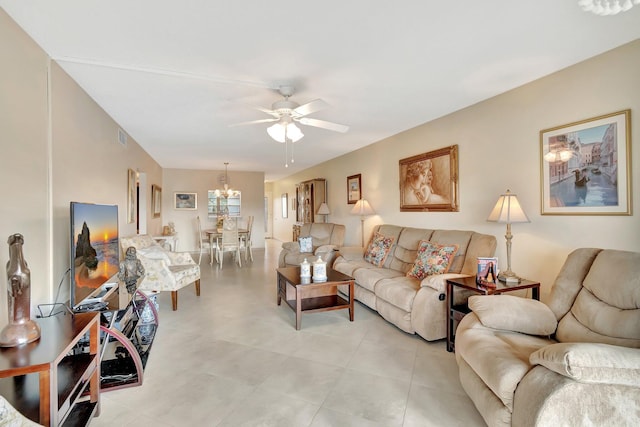 living area featuring ceiling fan with notable chandelier and visible vents