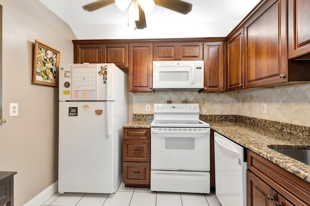 kitchen with decorative backsplash, white appliances, light tile patterned floors, and ceiling fan