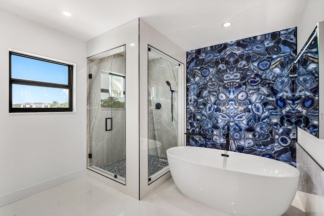 bathroom with a soaking tub, recessed lighting, and a stall shower