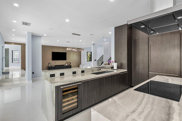 8387 Sawpine Rd, Delray Beach, FL 33446 - bar area with a sink, beverage cooler, wall chimney exhaust hood, recessed lighting, and black electric cooktop
