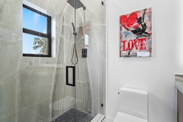 full bathroom with toilet and a marble finish shower