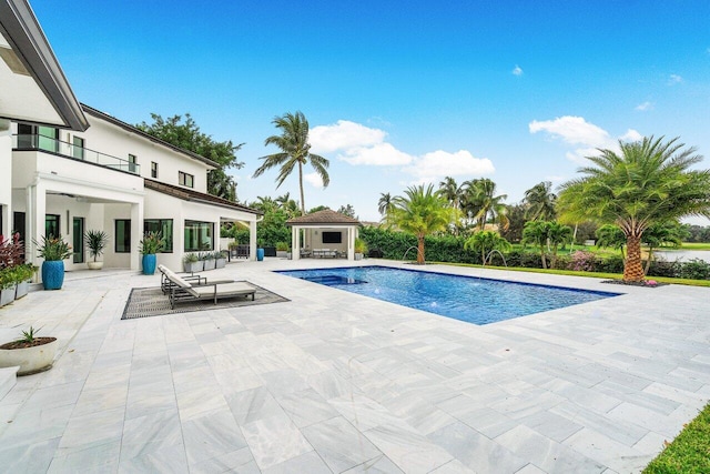 pool featuring a gazebo and a patio area