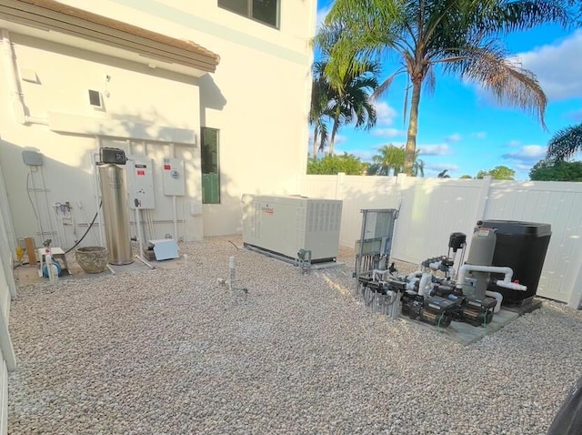 exterior space featuring a patio area and fence