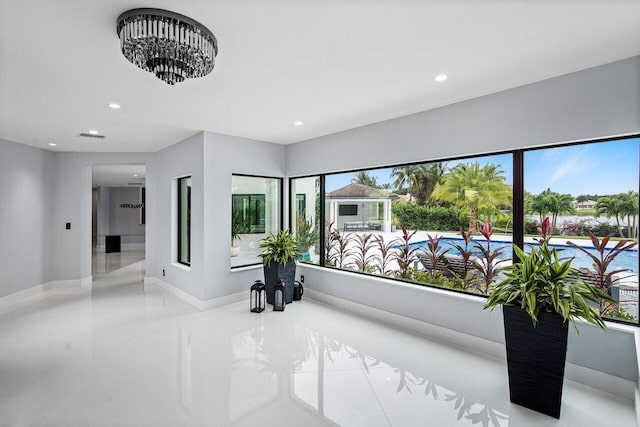 interior space with recessed lighting and baseboards