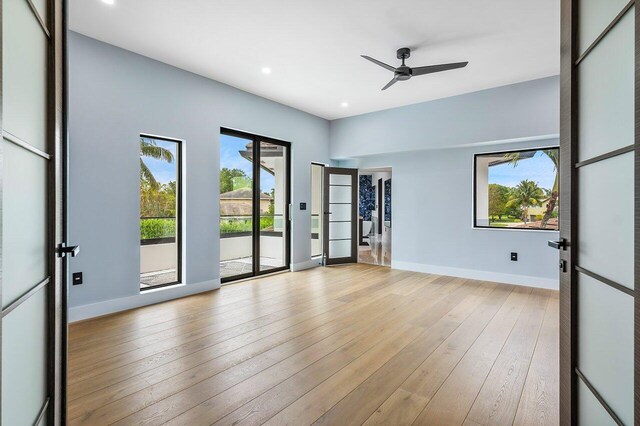 8387 Sawpine Rd, Delray Beach, FL 33446 - empty room with a ceiling fan, baseboards, recessed lighting, and light wood-style floors