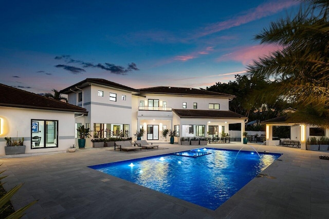 8387 Sawpine Rd, Delray Beach, FL 33446 - back of house with a patio, an outdoor pool, outdoor lounge area, and a gazebo