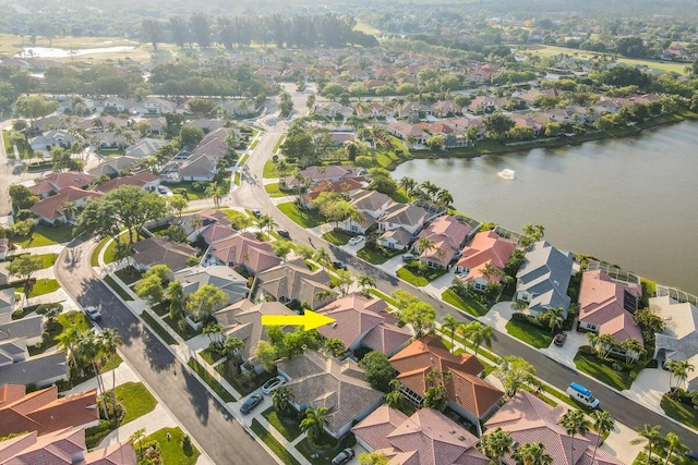 aerial view featuring a residential view and a water view