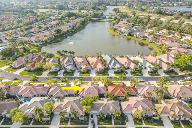 birds eye view of property featuring a residential view and a water view