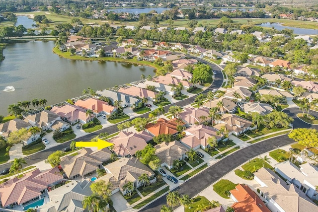 aerial view with a residential view and a water view