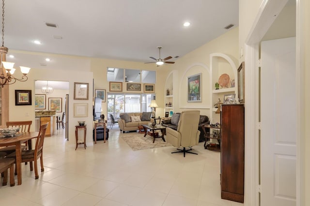 living room featuring recessed lighting, visible vents, ceiling fan with notable chandelier, and built in features