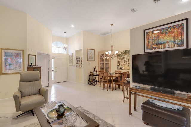 living area with recessed lighting, visible vents, baseboards, and a chandelier