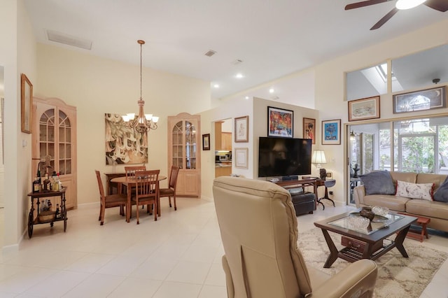 living area featuring visible vents, recessed lighting, high vaulted ceiling, and ceiling fan with notable chandelier