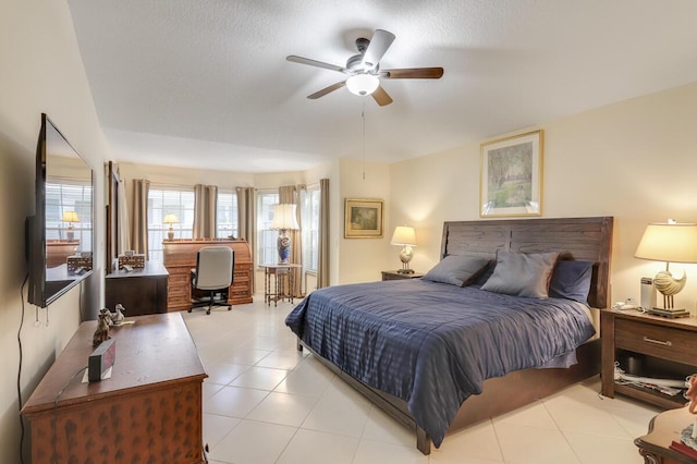 tiled bedroom with ceiling fan