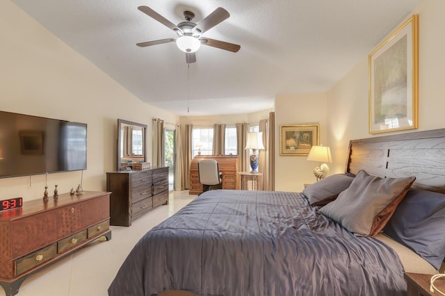 bedroom with tile patterned floors and a ceiling fan