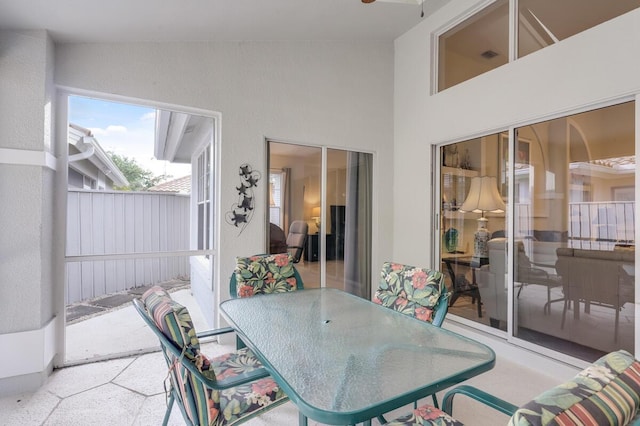 view of patio featuring outdoor dining space and fence