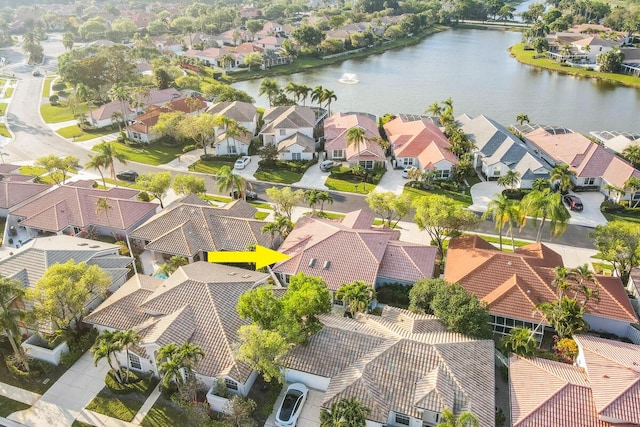 aerial view featuring a residential view and a water view