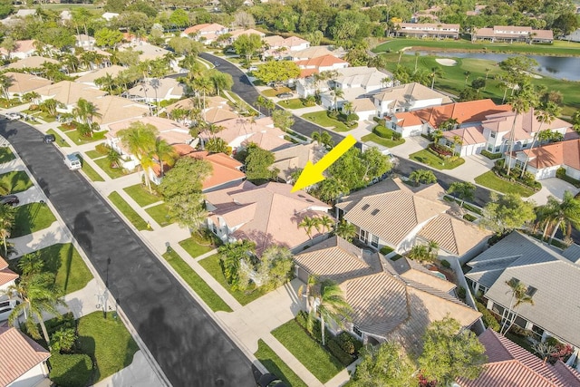 aerial view featuring a residential view and a water view