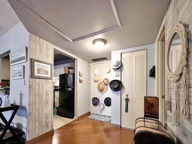 interior space featuring baseboards and wood finished floors