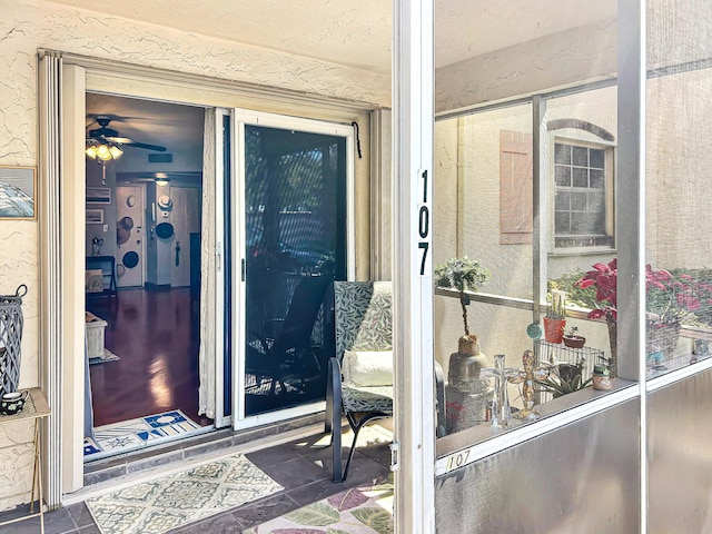 doorway to property with stucco siding