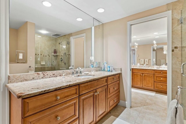 full bathroom featuring vanity, visible vents, recessed lighting, a shower stall, and tile patterned floors